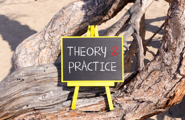 Theory and practice symbol. Concept words Theory and practice on beautiful black yellow blackboard....