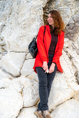 Portrait of beautiful young woman wearing red jacket outdoors - 768827849