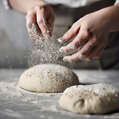 Person Sprinkling Flour on Top of a Doughnut