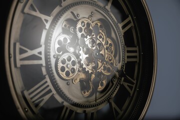 Closeup of an antique-style wooden clock on a wall