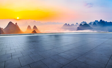 Empty square floor and beautiful mountain with fog at sunrise in Guilin