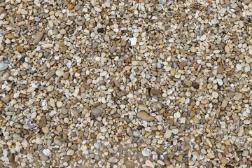 Gravel bed featuring a mix of brown, white and black rocks