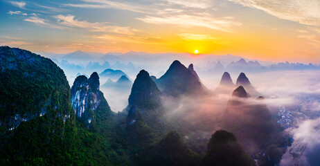 Aerial view of green mountain natural landscape at sunrise in Guilin, China.