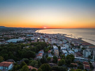 Aerial view of the stunning sunset over the Gabicce Mare and Romagna coast of Italy.