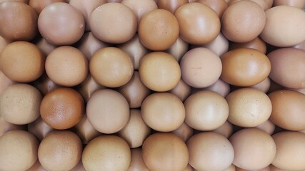 Pile of egg on the eggs cartoon in displayed in supermarket to attract the buyer	