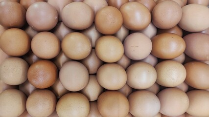 Pile of egg on the eggs cartoon in displayed in supermarket to attract the buyer	