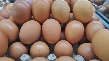 Pile of egg on the eggs cartoon in displayed in supermarket to attract the buyer	