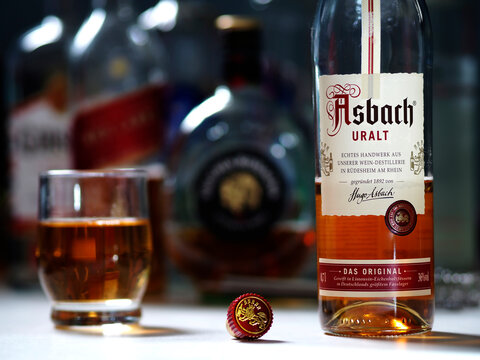 In this photo illustration, a bottle of Asbach Urbrand brandy seen displayed on a table.