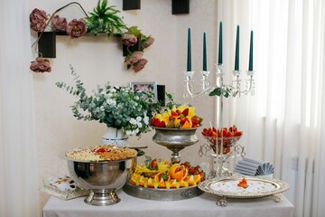 the dessert table has many dishes for sharing them with friends