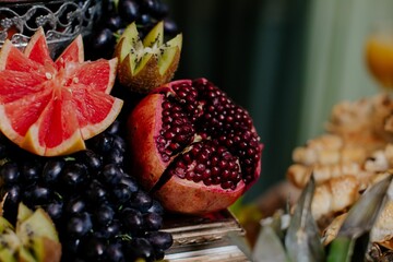 Variety of fresh fruits arranged neatly on a tabletop.