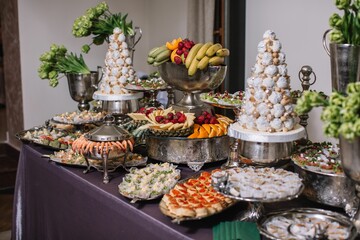 Table fourshette set with a variety of gourmet dishes.