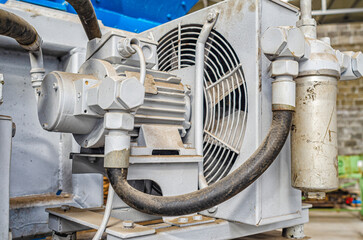 Rear view of an industrial fan in a paving factory. Industrial background.