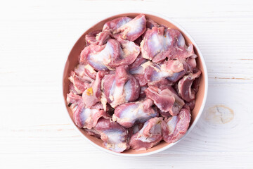 Raw chicken giblets gizzard ( stomach ) , meat background - 768844007