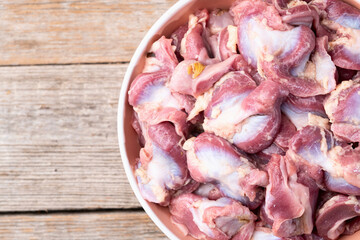 Raw chicken giblets gizzard ( stomach ) , meat background - 768844039