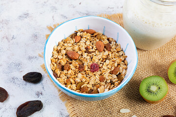 Bowl of granola with nuts, berries and yogurt. Muesli oats with fruits