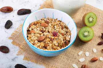 Bowl of granola with nuts, berries and yogurt. Muesli oats with fruits