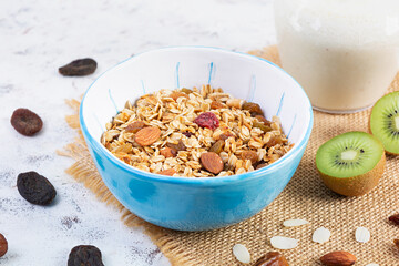 Bowl of granola with nuts, berries and yogurt. Muesli oats with fruits