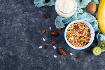 Bowl of granola with nuts, berries and yogurt. Muesli oats with fruits