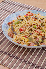 Noodles with meat, vegetables and mushrooms