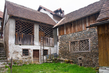 Old derelict stone buildings in the historic mountain village of Rigolato in Carnia, Friuli-Venezia...