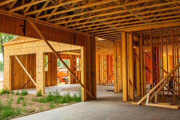 Interior wood framework of single family residential building under construction.
