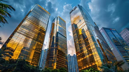 Foto op Aluminium Modern tall office buildings made of golden glass in the business center of Hong Kong. Copy space. Blurred background © Irina Beloglazova