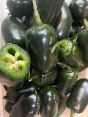 bullet chilli pepper dark green background at market
