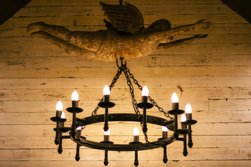 old candlestick with a candle on the ceiling