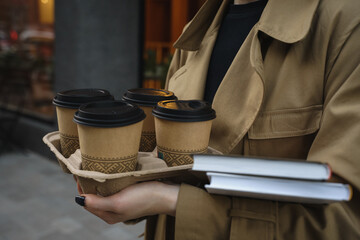 Take away coffee cups and books
