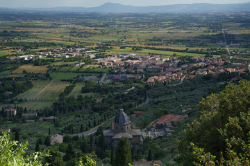 Fototapeta na wymiar Panoramic view from Cortona, Italy, at summer. Santa Maria delle Grazie al Calcinaio