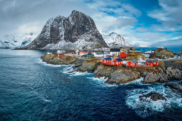 Hamnoy fishing village with red rorbu houses in Norwegian fjord in winter. Lofoten Islands, Norway - 768865090
