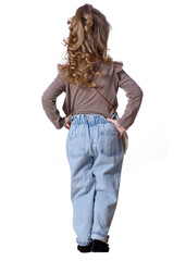 Little girl child in jeans and shirt looking on white background isolation, rear back view