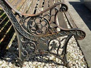 Old ornate metal bench in the public cemetery - Powered by Adobe