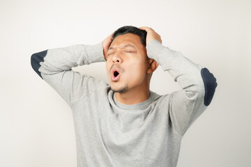 surprised, shocked expression of Asian Man, with his mouth open and wide open eyes, isolated background