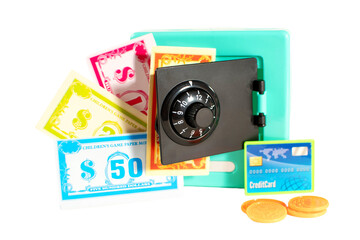 A toy bank with a key and a bunch of money in it. The money included