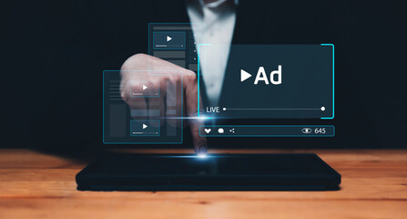 Video content advert Digital marketing concepts, using tablet watching  live stream online advertisements on streaming platforms social media and websites for traffic and awareness.