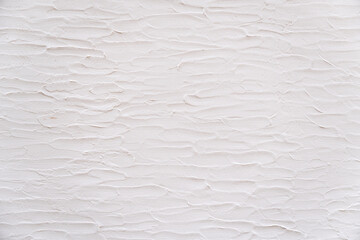Loft-style plaster walls, gray, white, empty space used as wallpaper. Popular in home design or...