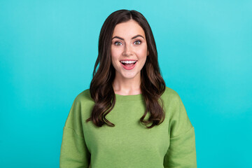 Photo of astonished cheerful girl open mouth stare speechless isolated on turquoise color background
