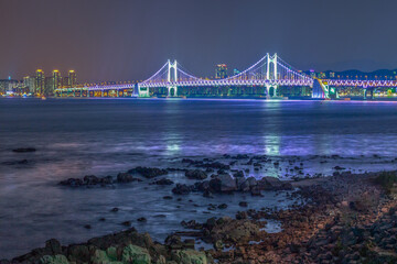The night view of Haeundae Beach in Busan, South Korea, where you can see Gwanghan Bridge.