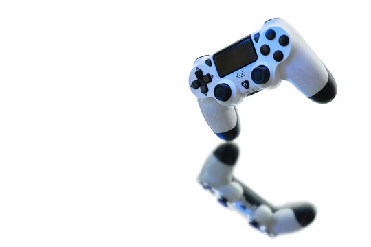 Gamepad on white background with reflection