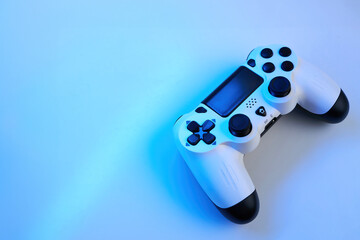 Gamepad on abstract background with light effects © Inna Vlasova