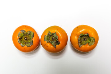 fresh ripe persimmons isolated on white background