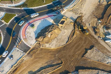 Foto op Plexiglas Industrial roadworks. Roundabout on wide American highway under construction. Development of transportation system for rapid transit © bilanol