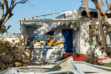 Property damage from strong hurricane winds. Mobile homes in Florida residential area with...