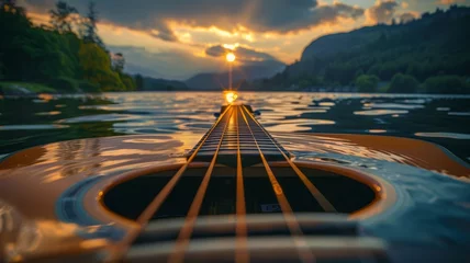 Foto op Canvas Guitar strings resonating into waves on a serene lake © Anuwat