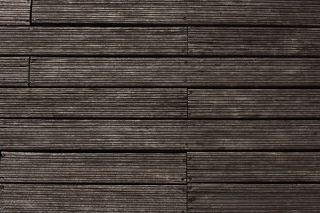 wooden planks cut and fastened with rusty nails and screws. Brown wood backgroud texture background