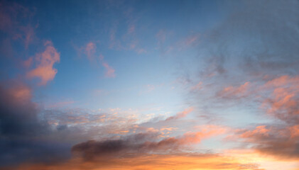 romantic sunset sky with pink clouds, blue in the upper half