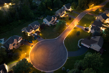 Top view of expensive two story private houses in Rochester NY suburbia at night. New family homes in upscale community. Real estate development in american suburbs