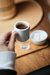 Person Holding a Cup of Coffee in the Morning