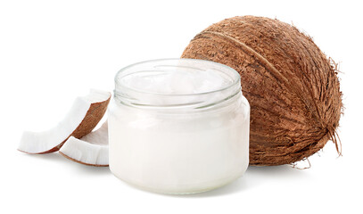 Glass jar of coconut oil and fresh whole coconut and pieces on white background